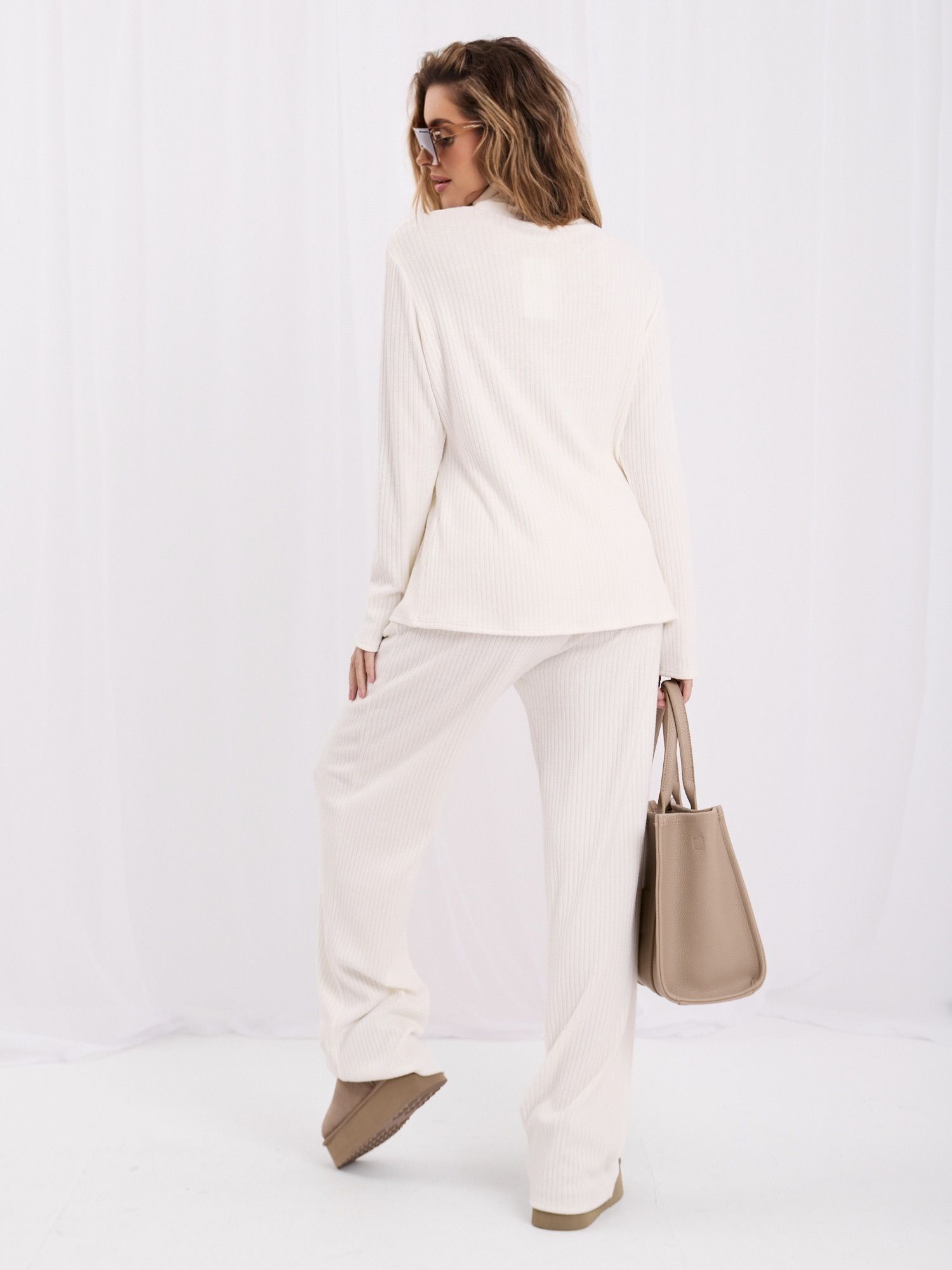 Ecru two-piece set with a turtleneck.