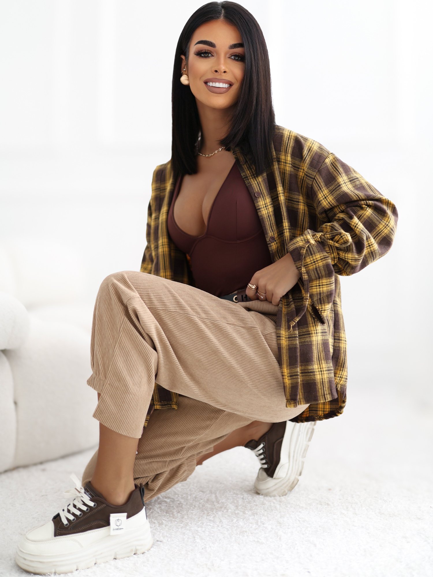 RUE PARIS Camel corduroy pants with an asymmetric leg.