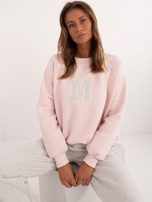 Hurt Jasnoróżowy dresowy komplet oversize z naszywką