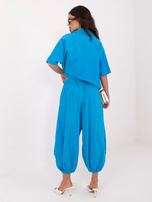 Niebieskie sztruksowe spodnie parachute z nogawką 7/8 