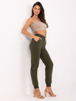 Khaki sweatpants with stitching.