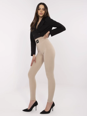 Beżowe damskie legginsy z ozdobną naszywką