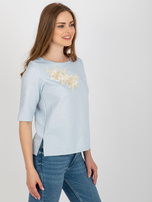 Light blue women's dress blouse with lace.