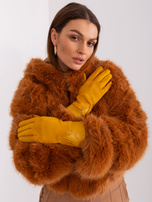 Didmeninė tamsiai geltonos elegantiškos moteriškos pirštinės.