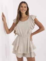 Beige muslin jumpsuit with an elastic waistband.