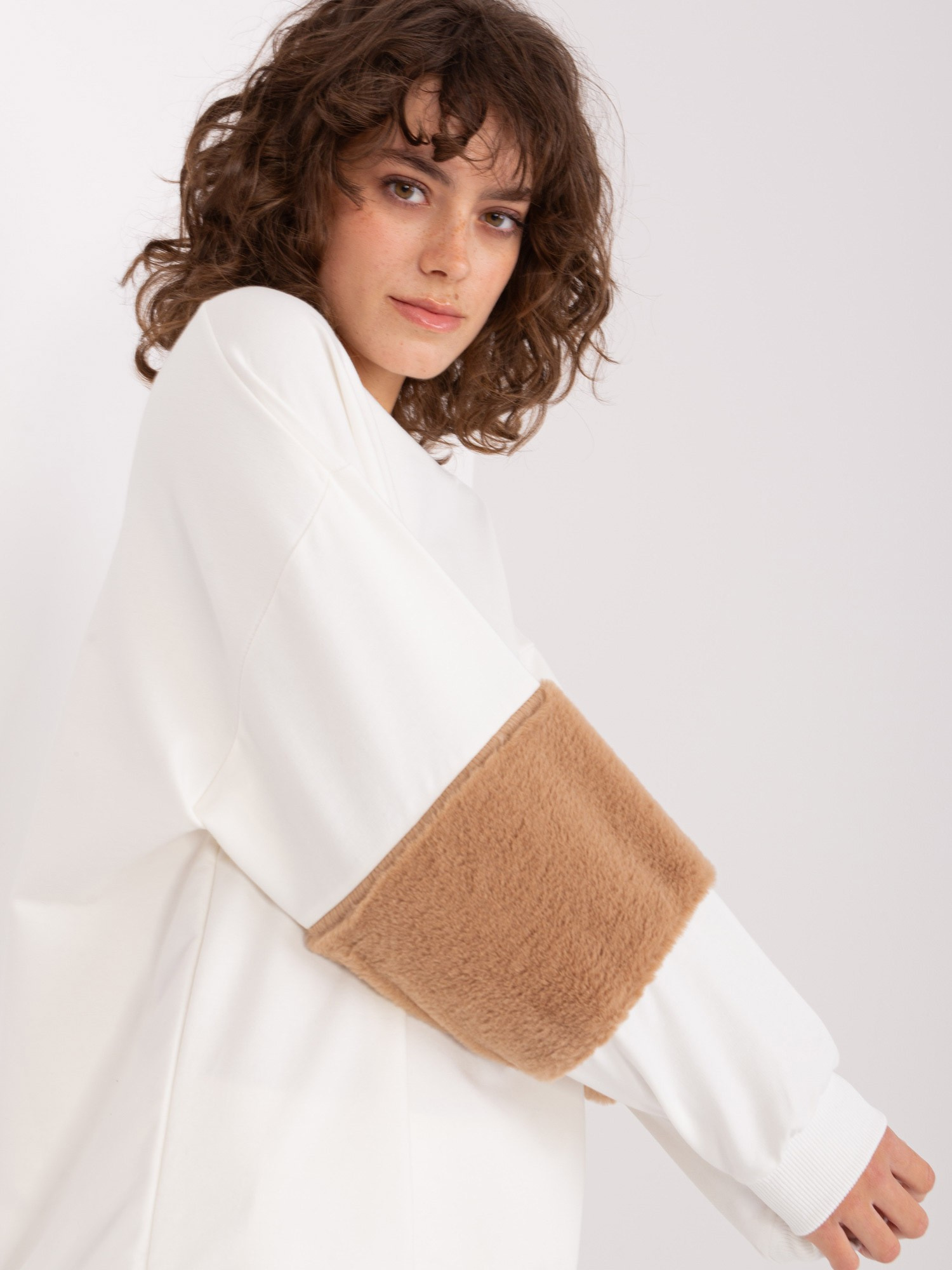 Hurt Ecru sweatshirt with fur inserts on the sleeves.