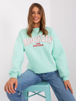 Hurt Miętowa damska bluza bez kaptura z napisem