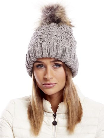 Brown hat with fur tassel
