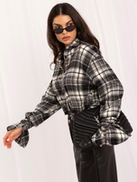 Black checkered shirt with flared sleeves.