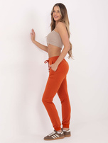 Ciemnopomarańczowe spodnie Faster