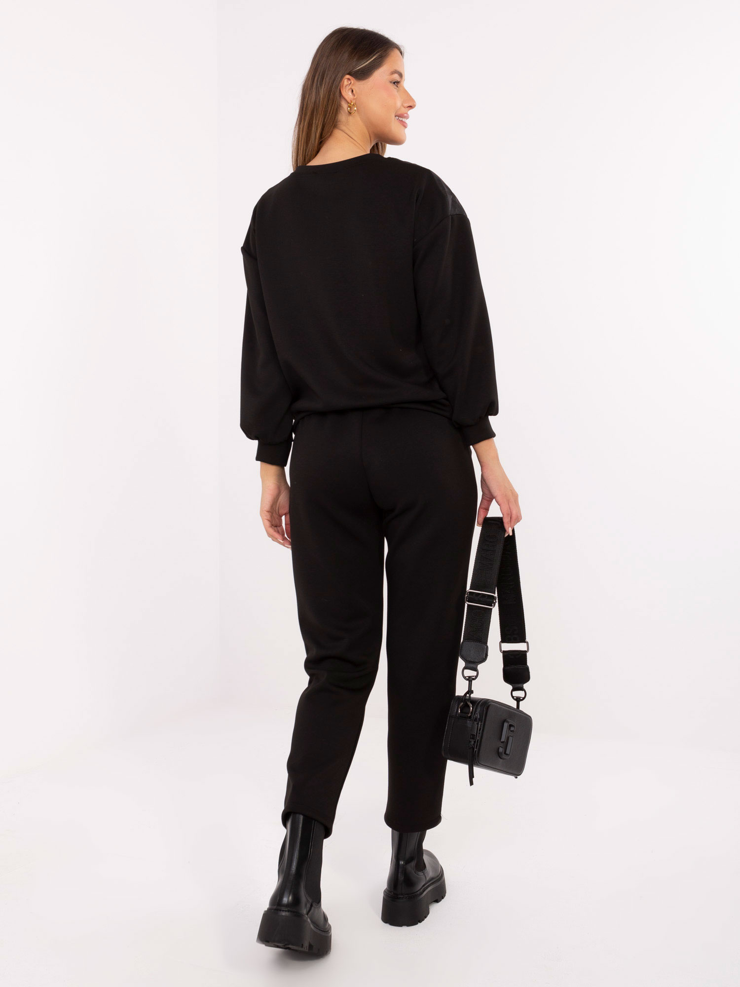 Black casual set with a detachable brooch.