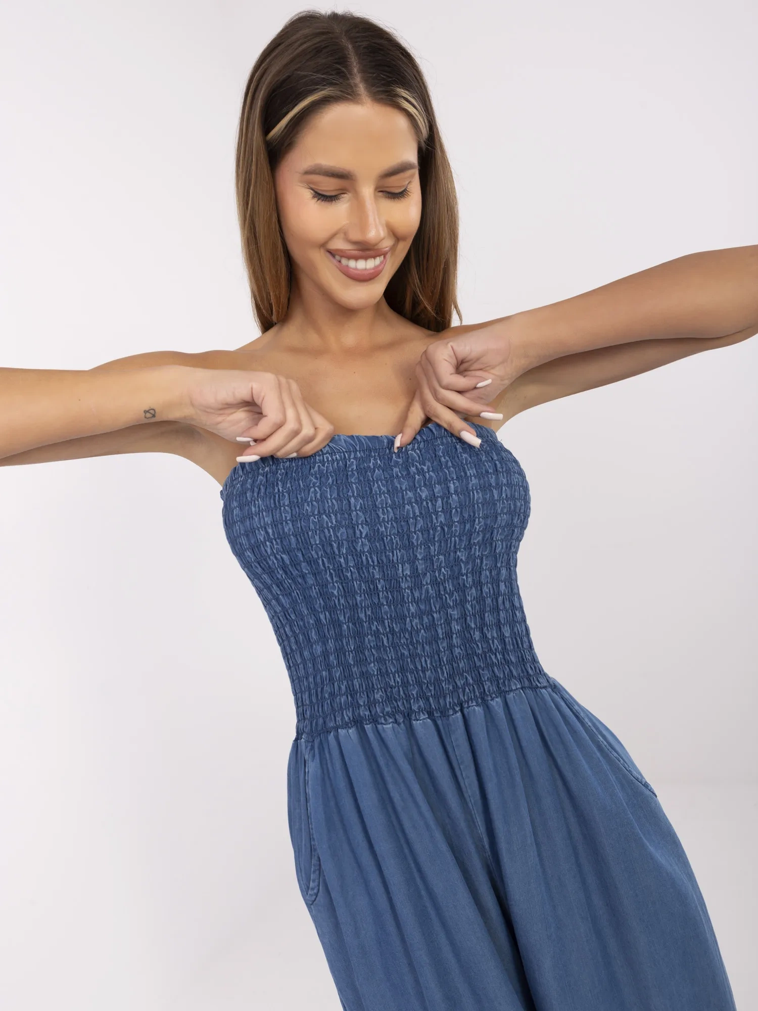 Dark blue summer jumpsuit made of thin denim.