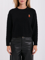 Black women's sweater with an embroidered bear.