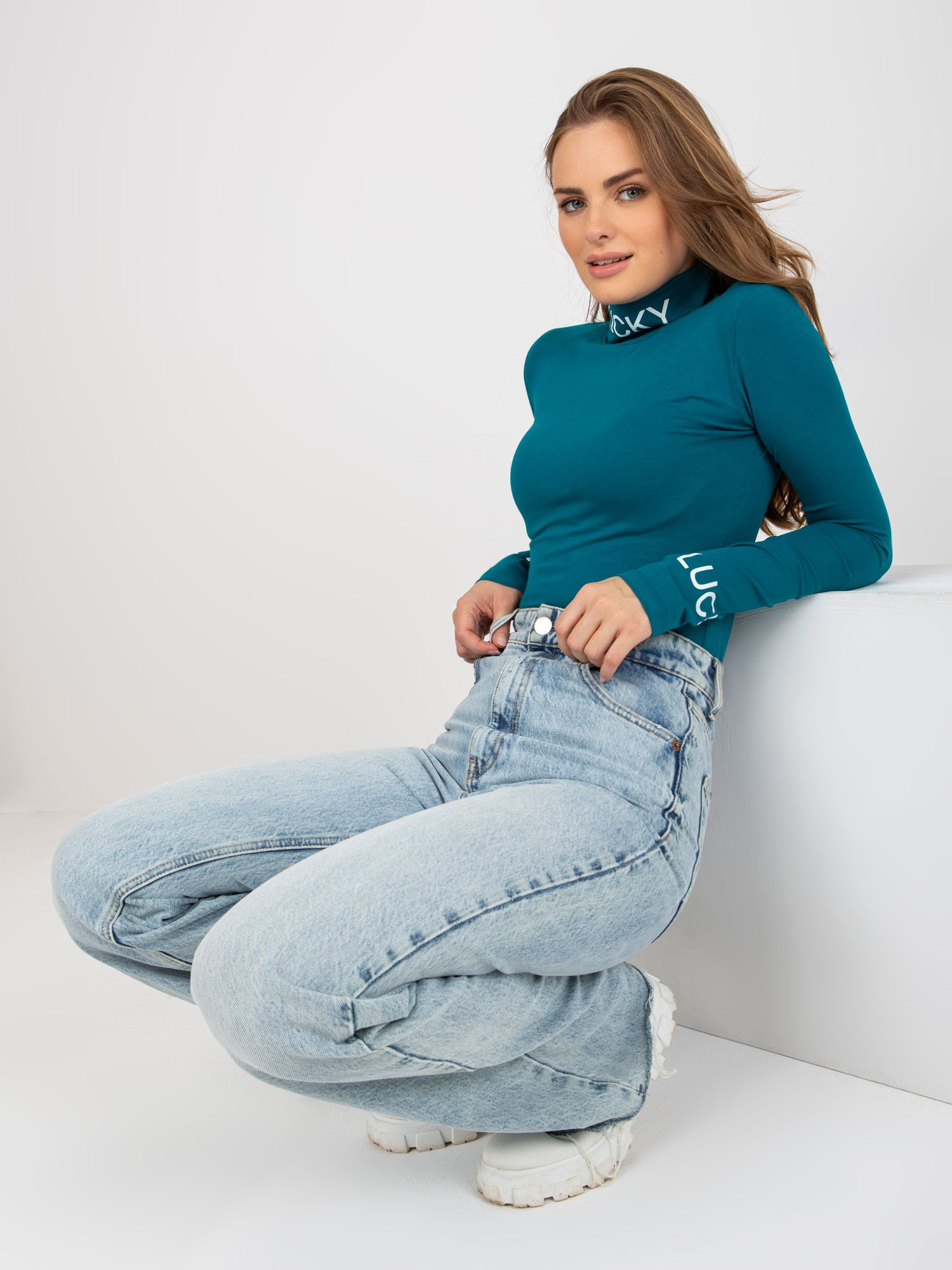 Hurt Morska fitted turtleneck blouse with Yarina inscriptions.