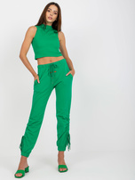 Green cotton sweatpants with cuffs.