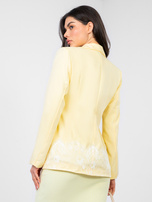 Pastelowa żółta elegancka marynarka z koronką