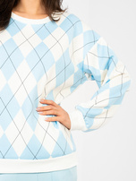 Pastelowa niebieska bluza w geometryczne wzory