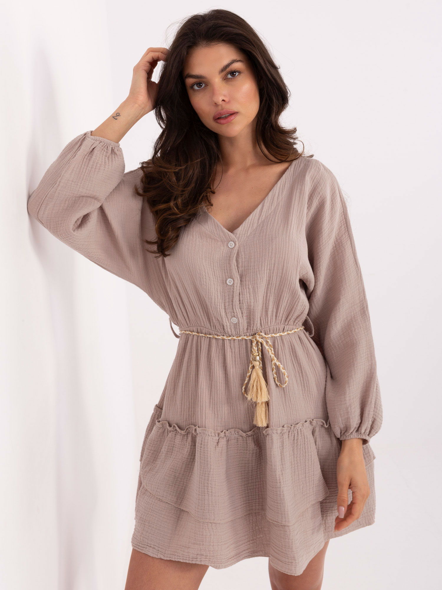 Dark beige muslin dress with a frill.