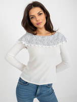 Beige-gray short blouse with exposed shoulders.