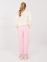 Jasnoróżowe dresowe spodnie wiązane w kostce