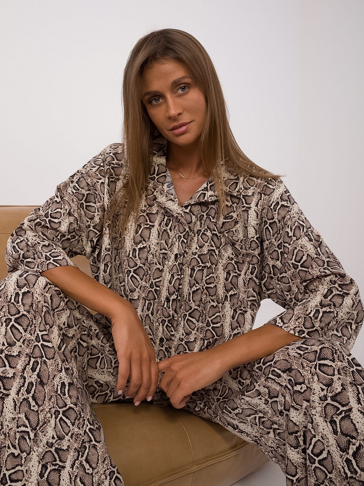 Beige-black two-piece set in animal pattern.