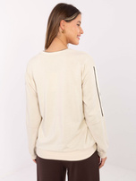 Jasnobeżowa bluza oversize z naszywką 
