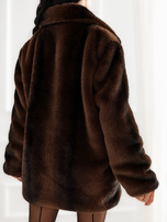 Brown women's fur with double-breasted closure.