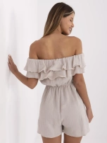 Beige muslin jumpsuit off-the-shoulder.
