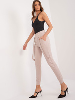 Hurt Beżowe spodnie dresowe z kieszeniami