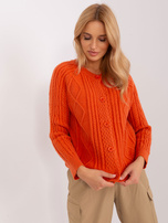 Didmeninė prekyba: oranžinė moteriška megztinis su mygtukais.