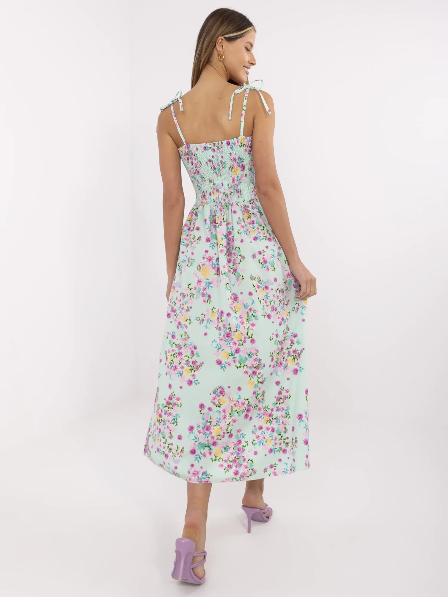 Mint long dress with tied straps.