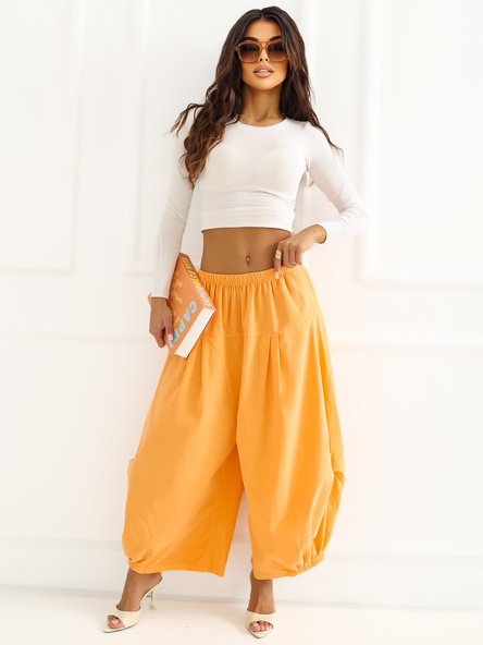 Jasnopomarańczowe sztruksowe spodnie z nogawką 7/8