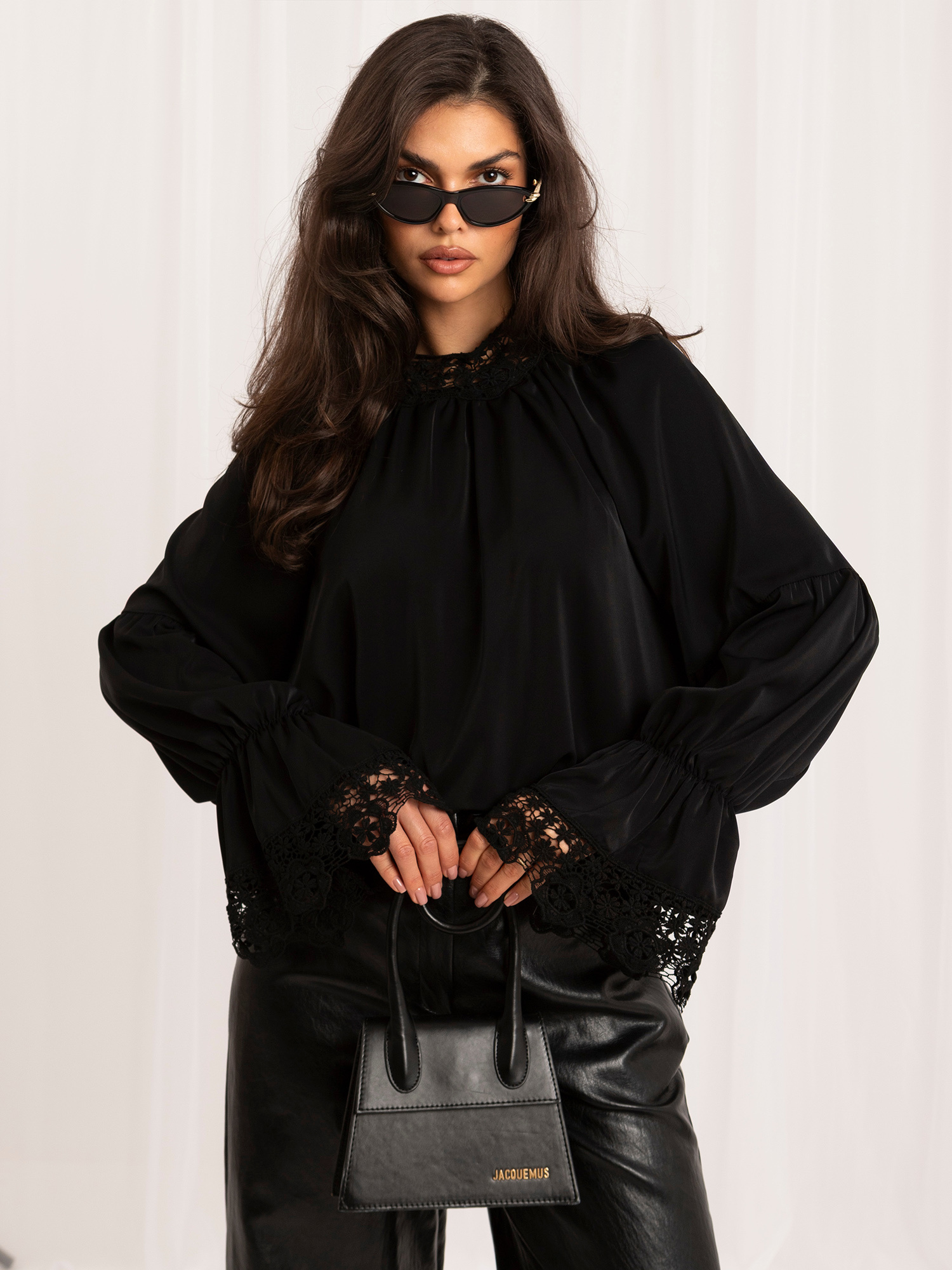 Black elegant blouse with puffed sleeves.