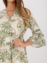 Green summer dress with patterns.