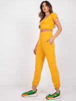 Jasnopomarańczowe spodnie dresowe z kieszeniami RUE PARIS 