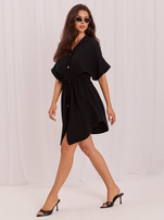 Black muslin dress with short sleeves.