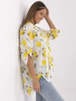 Ecru-yellow asymmetrical shirt with embroidery.