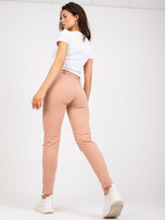 Beżowe spodnie z materiału z kieszeniami RUE PARIS