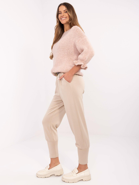 Hurt Beżowe dresowe spodnie z brązowym paskiem