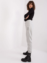 Light gray sweatpants with SUBLEVEL print.
