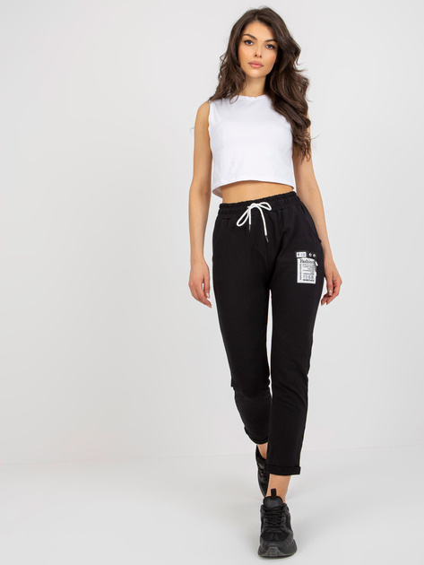 Hurtownia Czarne damskie spodnie dresowe z naszywką