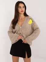 Beige zip-up sweater with a print on the back.