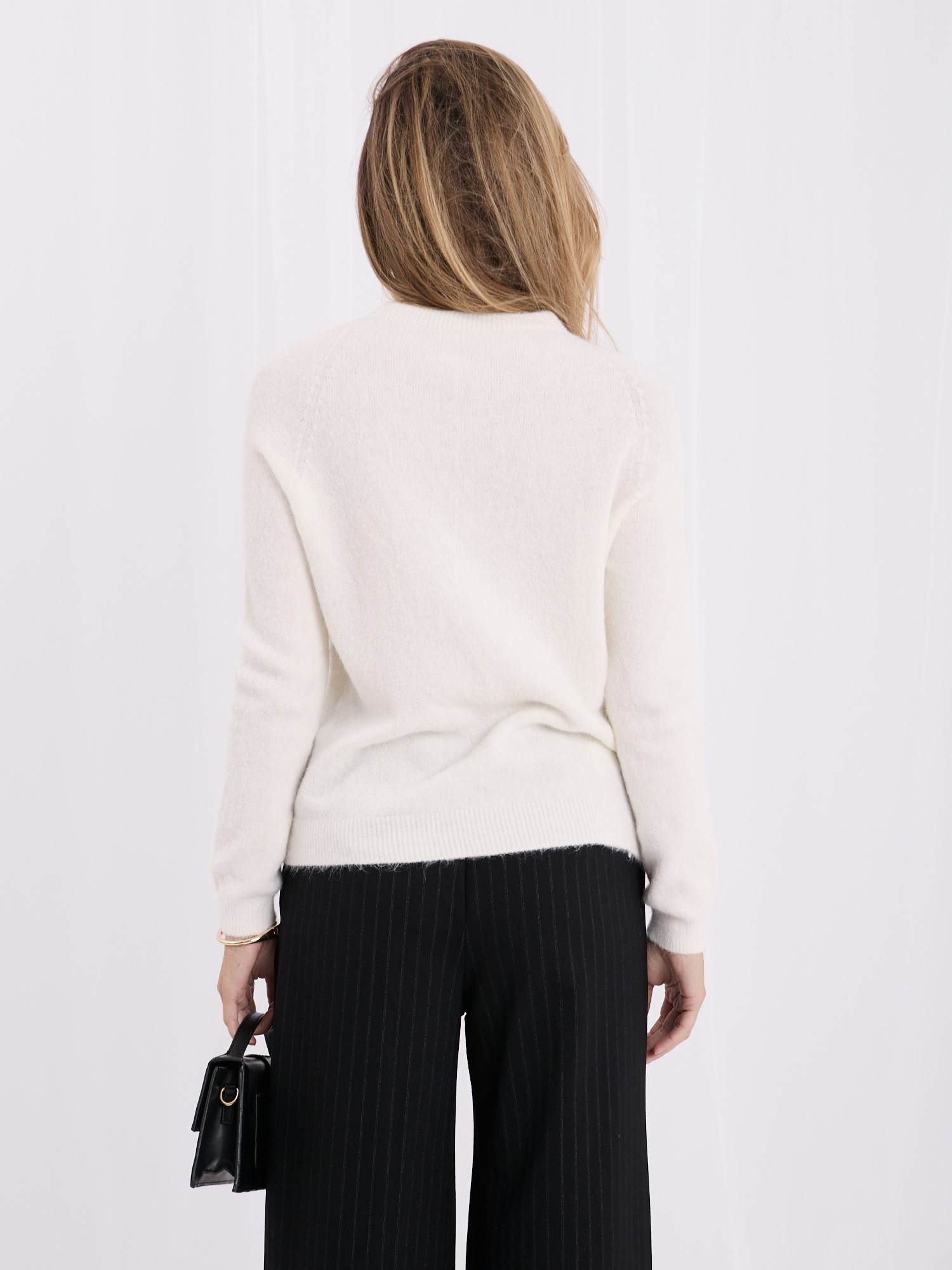 Ecru soft basic sweater with long sleeves.