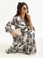 Black flared dress with a print.