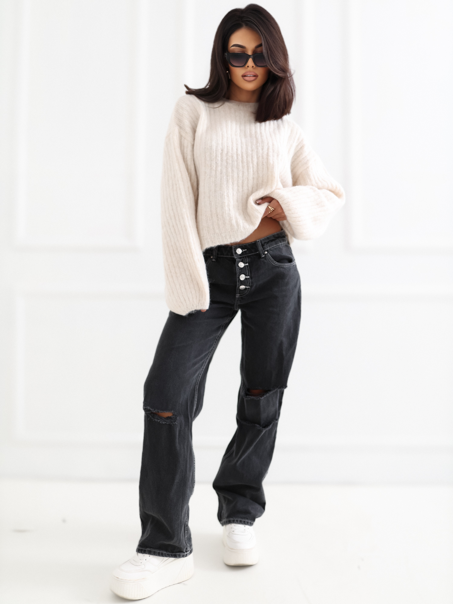 Light beige soft oversized sweater with a round neckline.