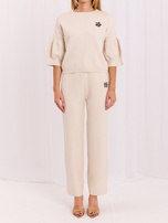 Light beige knitted set in an elegant style.