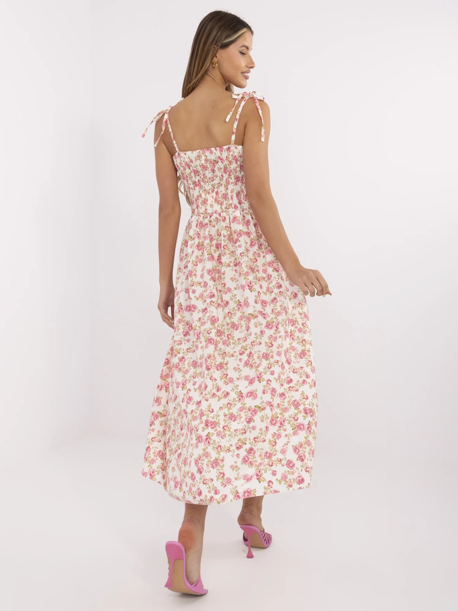 Ecru flared dress with flowers.