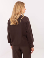 Dark brown cotton blouse with a ribbed cuff.