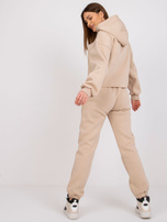 Beżowy komplet dresowy z napisem Laraina