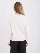 Ecru short cardigan with an embroidered dog.